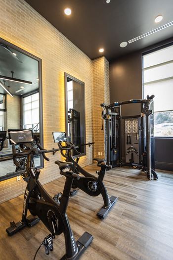 A room filled with lots of different types of exercise equipment